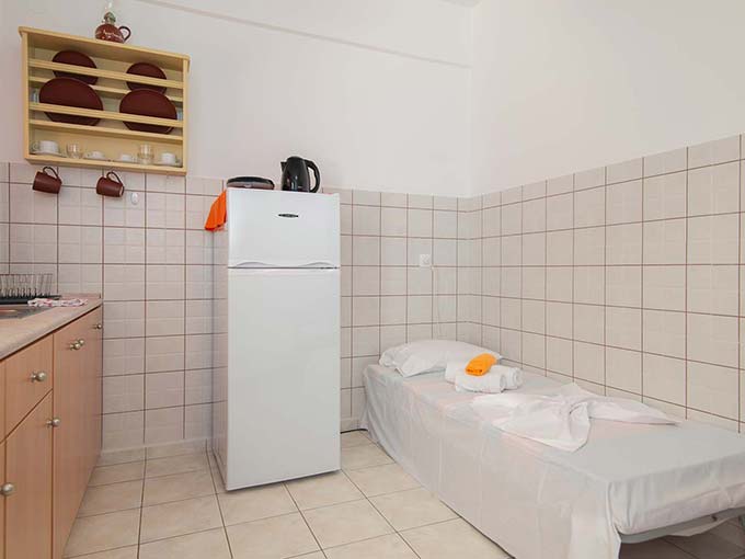 Single bed in the kitchen room