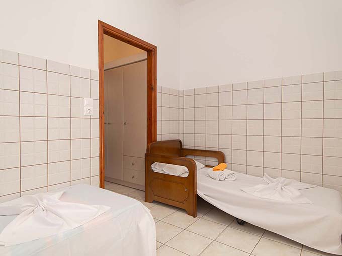 Two single beds in the kitchen room